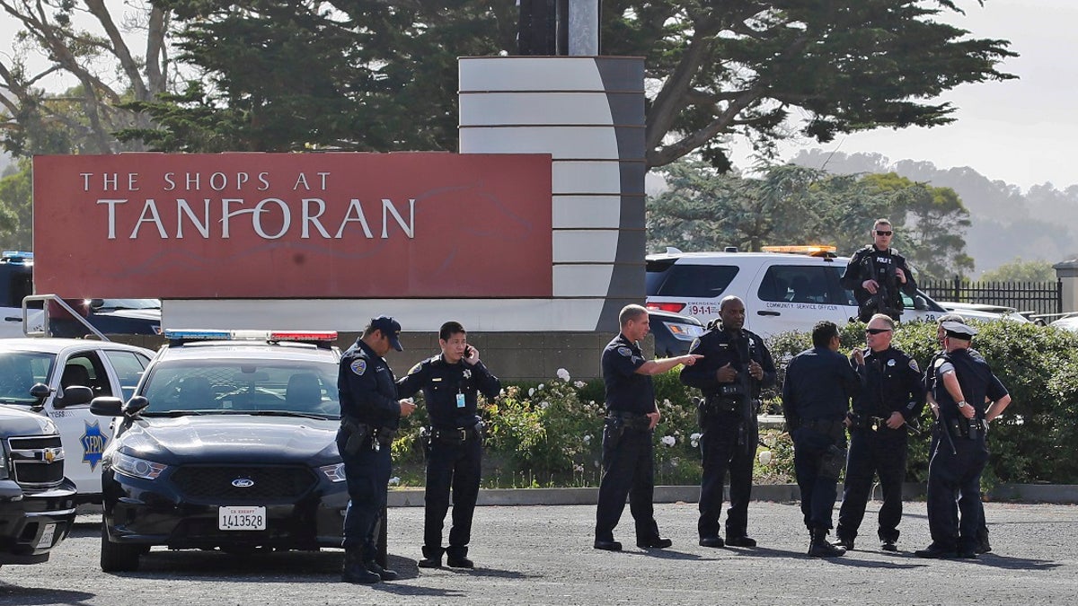 Police investigate at the scene of a shooting at the Tanforan Mall in San Bruno, Calif., Tuesday, July 2, 2019. Police are searching for suspects after at least two people were wounded in a mall shooting near San Francisco on Tuesday that led to region-wide transit delays at rush hour. (AP Photo/Stephanie Mullen)