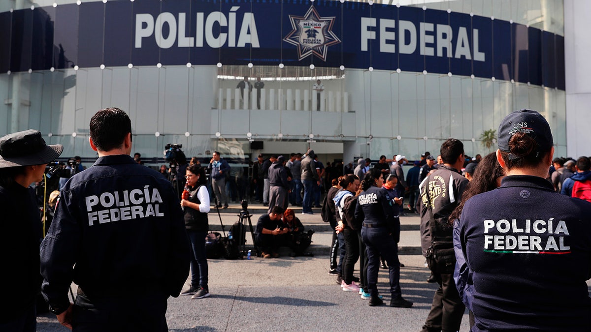 Striking police continue to hold a federal police command center in the Iztapalapa borough, in Mexico City, Thursday, July 4, 2019, to protest against plans to force them into the newly formed National Guard. On Wednesday, federal police held the command center and blocked key highways around the capital. They expressed concerns about potentially losing their salaries, benefits and seniority if they transferred to the National Guard and being left unemployed if they don't join the new force. (AP Photo/Marco Ugarte)