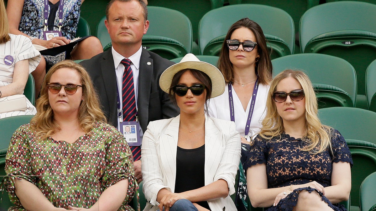 The Duchess of Sussex watches Serena Williams play Kaja Juvan in a singles match during day four of the Wimbledon Tennis Championships. (AP Photo/Tim Ireland)