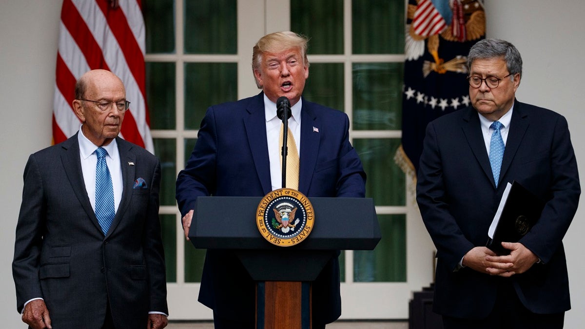 President Trump, joined by Commerce Secretary Wilbur Ross, left, and Attorney General William Barr, speaks during an event about the census in the Rose Garden this month. (AP Photo/Carolyn Kaster)