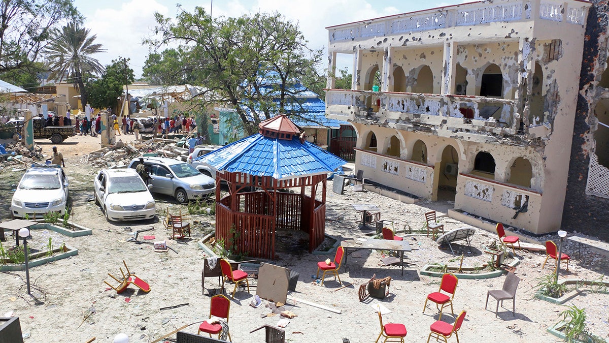 A view of Asasey Hotel after an attack, in Kismayo , Somalia, Saturday July 13, 2019. At least 10 people, including two journalists, were killed in an extremist attack Friday on a hotel in the port city of Kismayo, a Somali official said. The attack started with a suicide car bomb blast and then gunmen stormed into the hotel. (AP Photo)