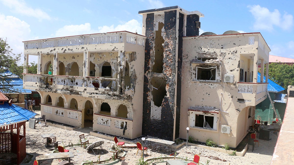 A view of Asasey Hotel after an attack, in Kismayo , Somalia, Saturday July 13, 2019. At least 10 people, including two journalists, were killed in an extremist attack Friday on a hotel in the port city of Kismayo, a Somali official said. The attack started with a suicide car bomb blast and then gunmen stormed into the hotel. (AP Photo)