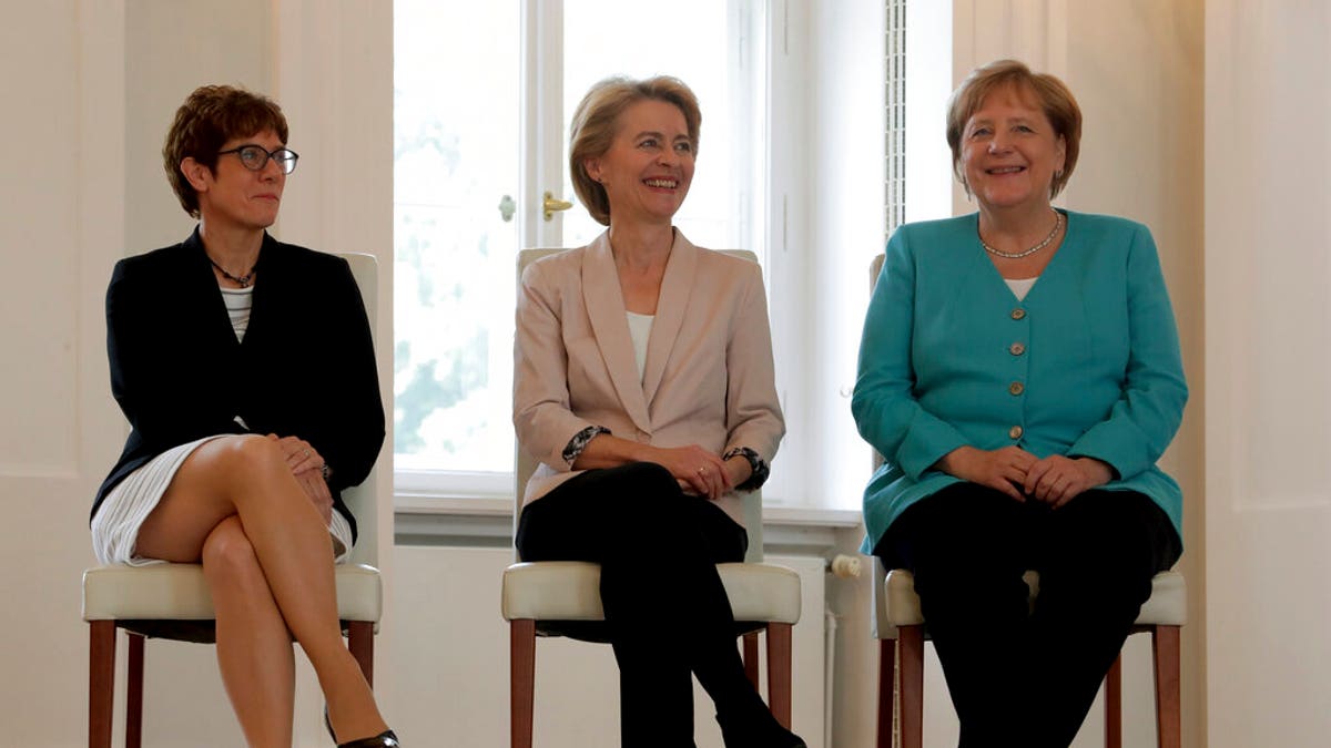 From right, German Chancellor Angela Merkel, new elected European Commission President Ursula von der Leyen and Annegret Kramp-Karrenbauer, von der Leyen's successor as German Defense Minister, attend an office over ceremony at the Bellevue Palace in Berlin, Germany, Wednesday, July 17, 2019.
