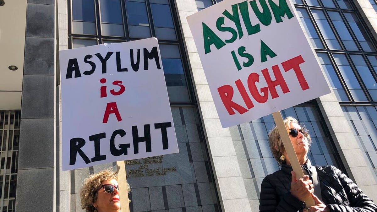 Protestors holding signs that read "Asylum is a Right" outside of the San Francisco Federal Courthouse on Wednesday.