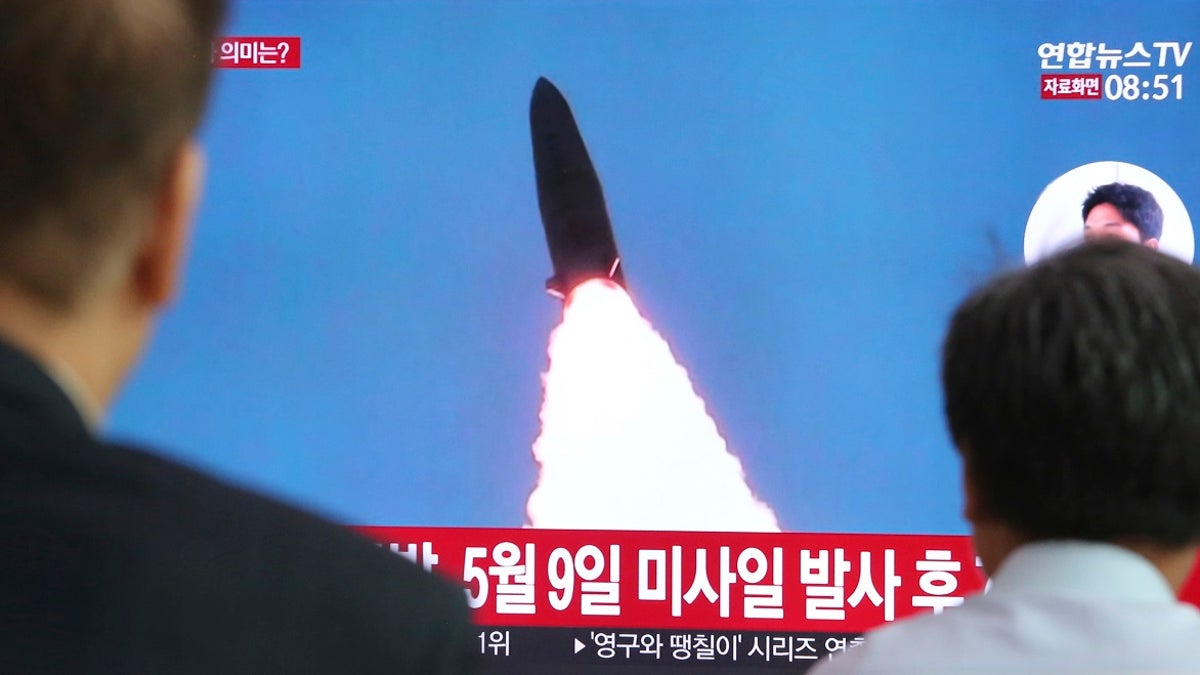 People watching a TV showing a file image of North Korea's missile launch during a news program at the Seoul Railway Station in Seoul, South Korea, Thursday. (AP Photo/Ahn Young-joon)