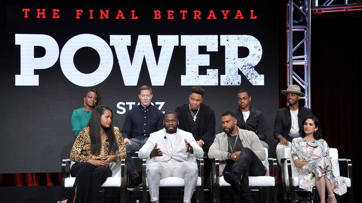 Naturi Naughton, from back row left, Joseph Sikora, Rotimi, Michael Rainey, Jr., Larenz Tate, and from front row left, creator/executive producer Courtney A. Kemp, Curtis "50 Cent" Jackson, Omari Hardwick and Lela Loren participate in the Starz "Power" panel at the Television Critics Association Summer Press Tour on Friday, July 26, 2019, in Beverly Hills, Calif. (Photo by Richard Shotwell/Invision/AP)