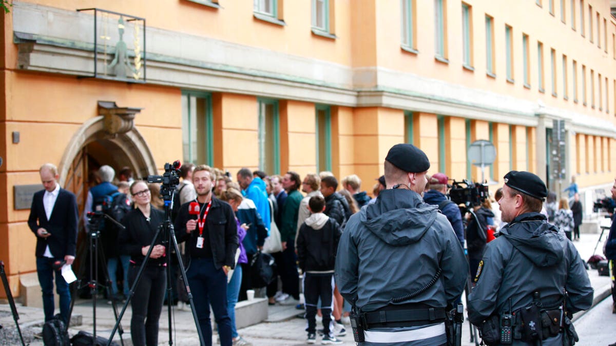 Journalists wait outside the district court where American rapper A$AP Rocky is to appear on charges of assault in Stockholm, Sweden, on Tuesday.