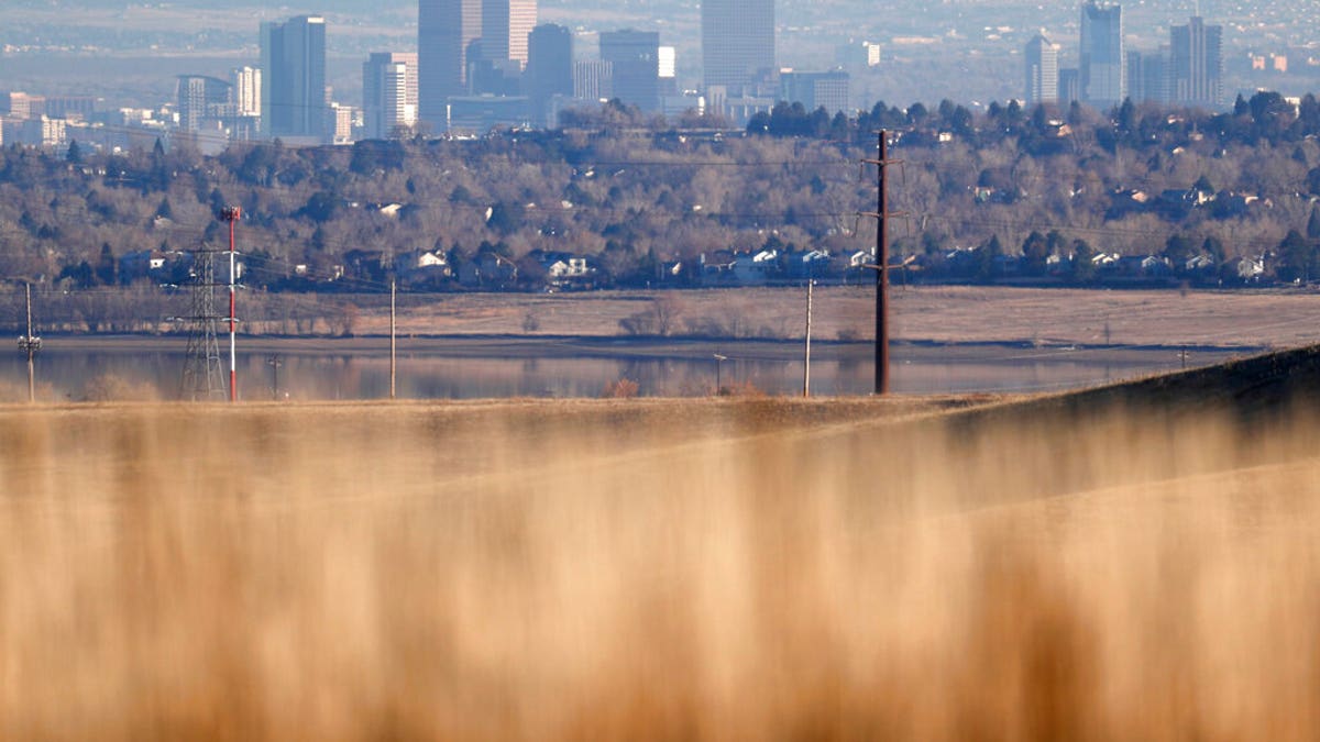 The Denver skyline is visible from the prairies in the Rocky Flats National Wildlife Refuge.