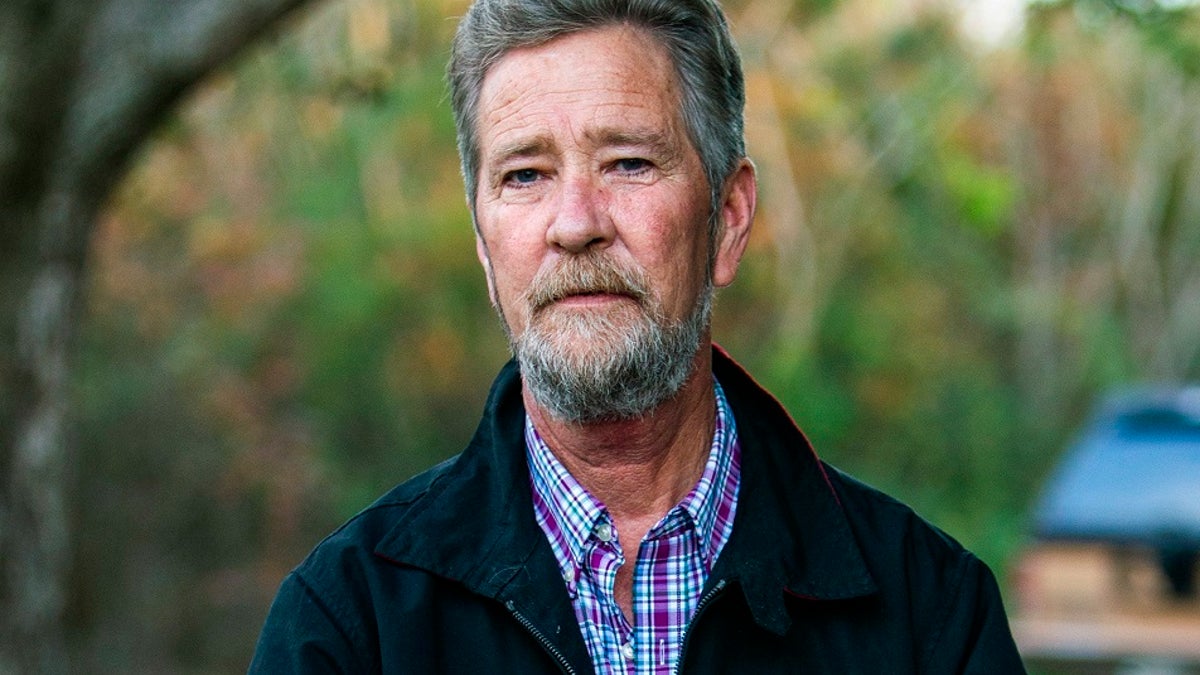 In this Dec. 5, 2018, photo, Leslie McCrae Dowless poses outside his home in Bladenboro, N.C. (Travis Long/The News & Observer via AP, File)