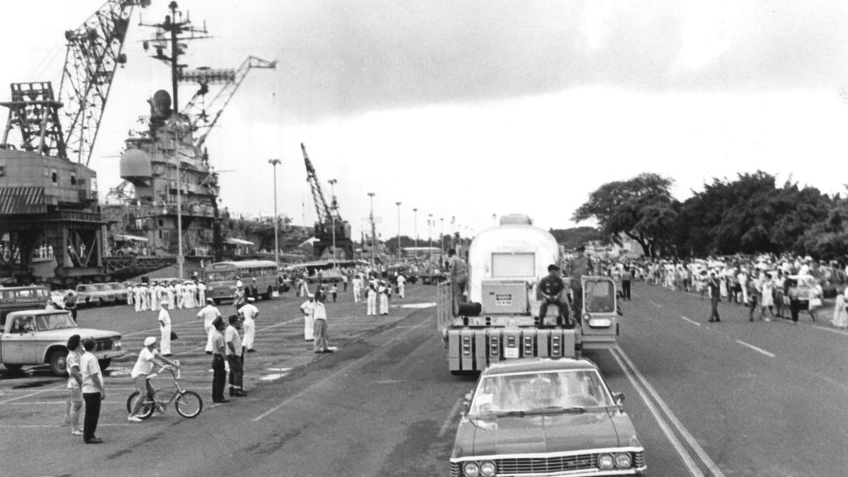 The MQF carrying the Apollo 11 crew is shown being transported to Hickam Air Force Base in Hawaii.