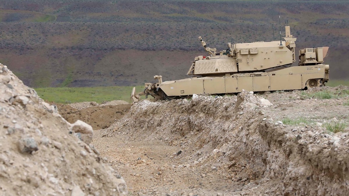 A remote-controlled concept assault breacher vehicle prepares to breach an obstacle during field testing at the Joint Warfighting Assessment 19, April 28, 2019.