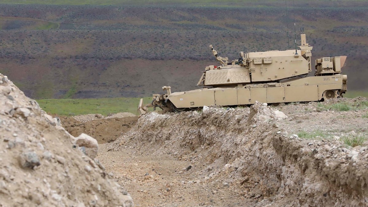A remote-controlled concept assault breacher vehicle prepares to breach an obstacle during field testing at the Joint Warfighting Assessment 19, April 28, 2019.