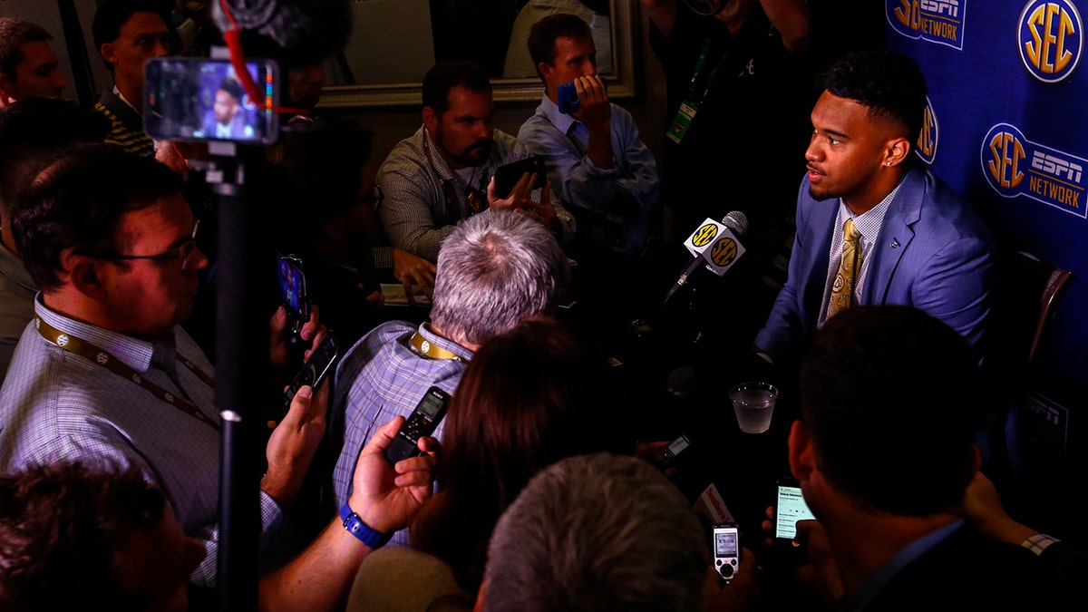 Alabama quarterback Tua Tagovailoa speaks to reporters during the NCAA college football Southeastern Conference Media Days, Wednesday, July 17, 2019, in Hoover, Ala. (AP Photo/Butch Dill)