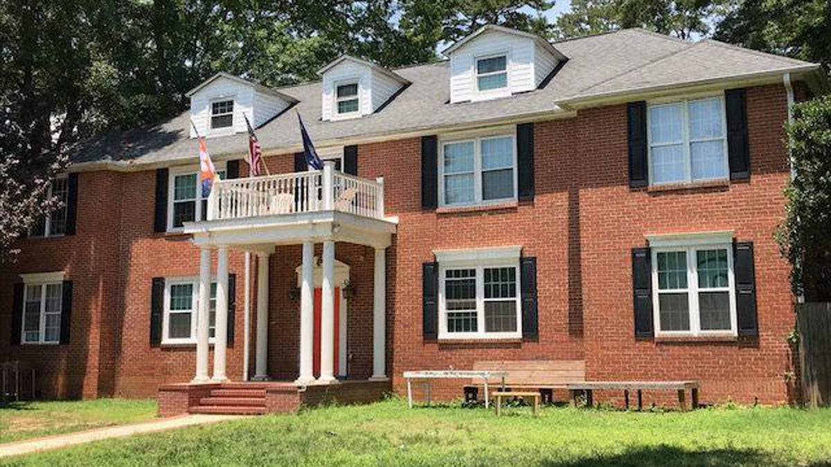 A Clemson University student died early Sunday after falling off the roof of a home, according to officials.