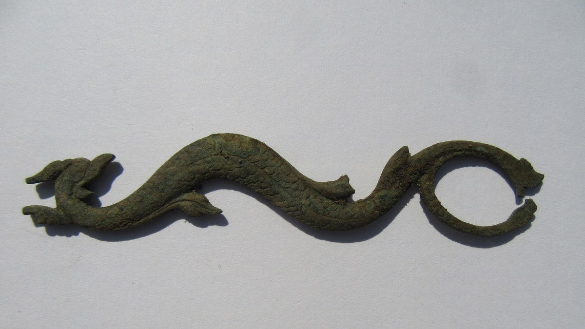 The serpent-shaped sideplate is from a British trade gun that dates back to the 1760s or 1770s.