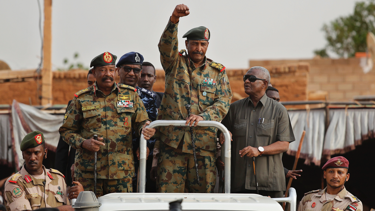 In this Saturday, June 29, 2019, file photo, Sudanese Gen. Abdel-Fattah Burhan, head of the military council, waves to his supporters upon his arrival to attend a military-backed rally in Omdurman district, west of Khartoum, Sudan. 