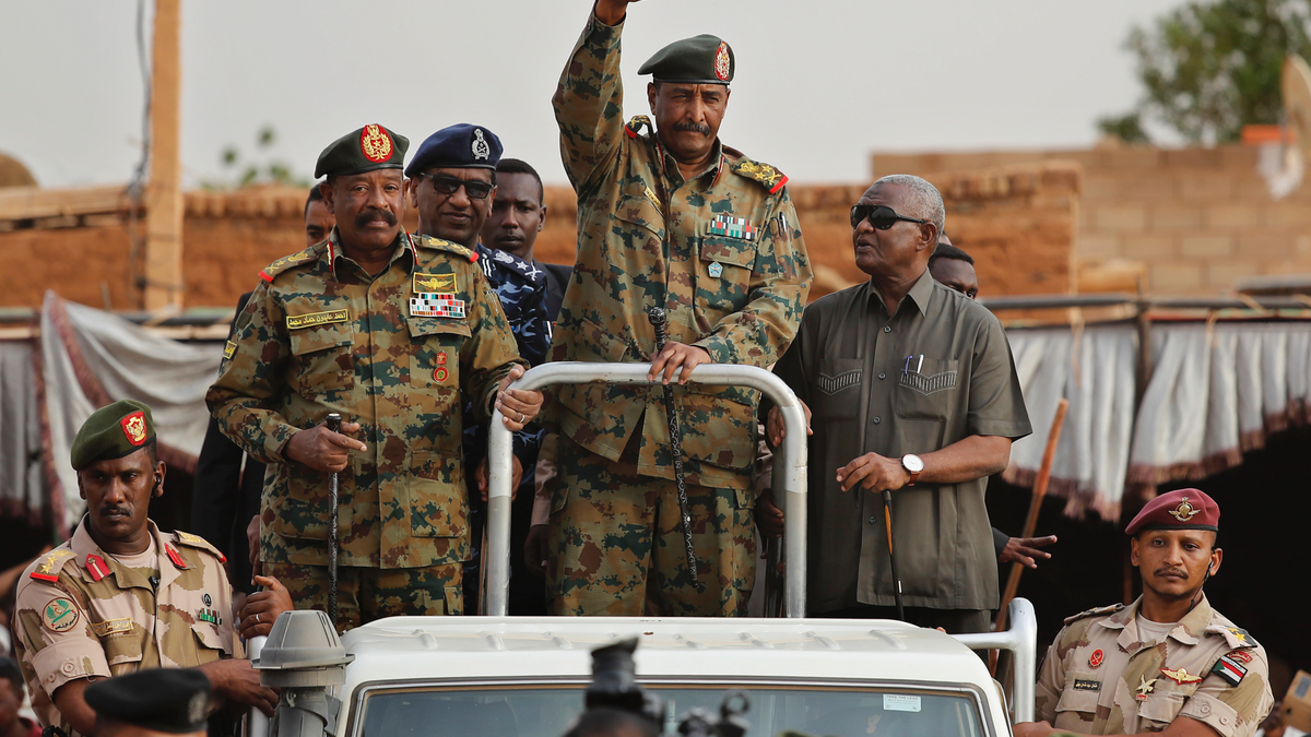 In this Saturday, June 29, 2019, file photo, Sudanese Gen. Abdel-Fattah Burhan, head of the military council, waves to his supporters upon his arrival to attend a military-backed rally in Omdurman district, west of Khartoum, Sudan.