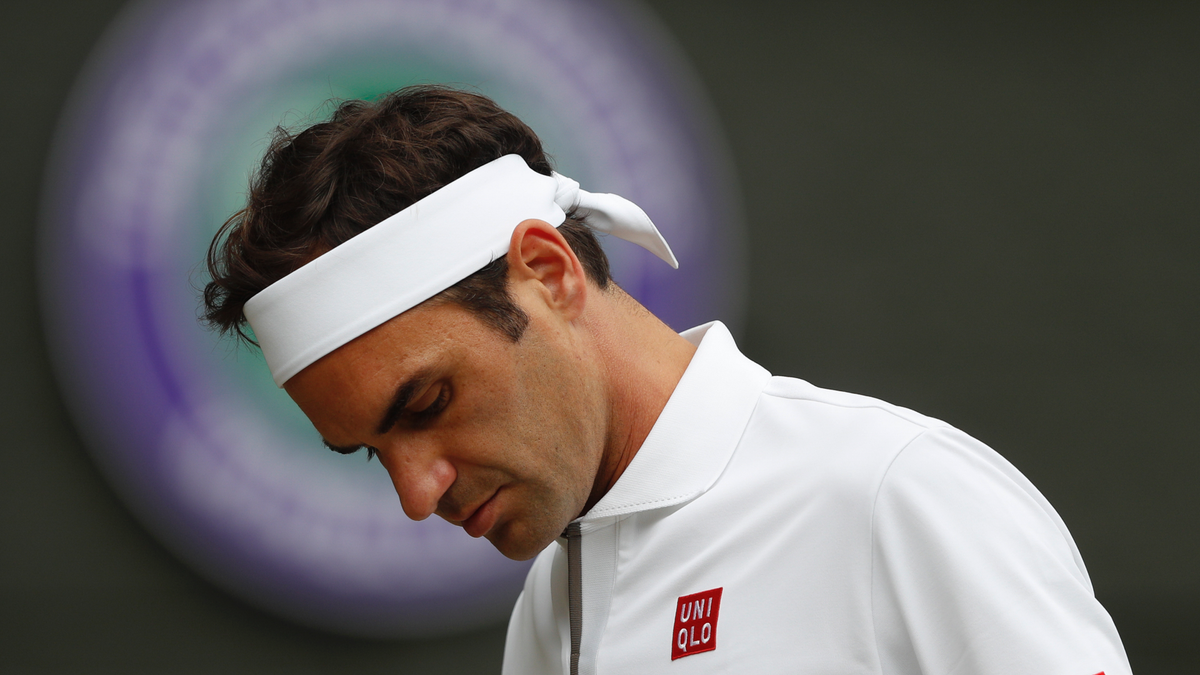 Roger Federer is dejected after losing a point to Serbia's Novak Djokovic during the men's singles final match of the Wimbledon Tennis Championships in London, Sunday, July 14, 2019. (Adrian Dennis/Pool Photo via AP)