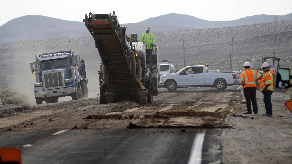 Crews work on repairing a section of highway 178 in the aftermath of an earthquake Sunday, July 7, 2019, near Trona, Calif.