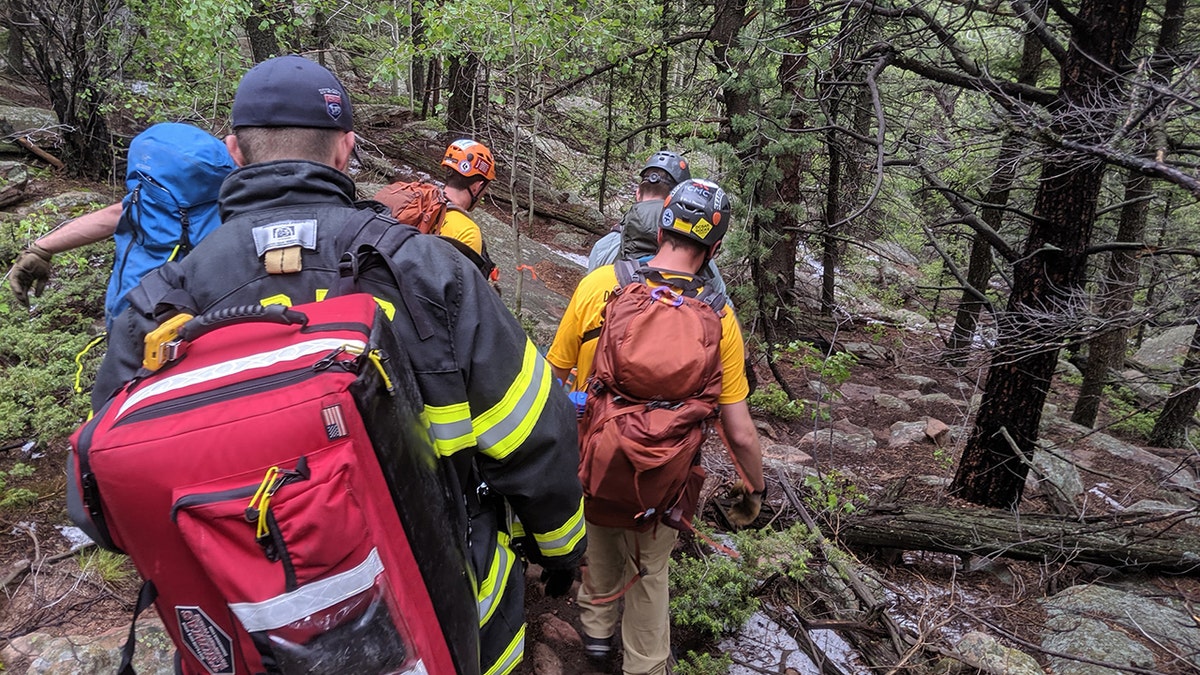 A woman told Colorado she was seeking shelter with a group of hikers when the lightning struck nearby.