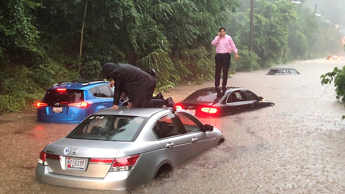 Motorists are stranded on a flooded section of Canal Road in Washington during a heavy rainstorm, Monday, July 8, 2019.