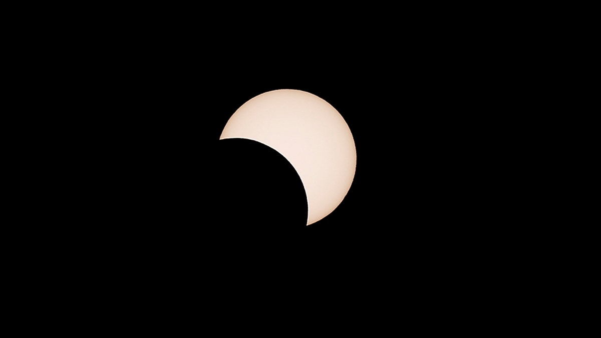 A partial solar eclipse observed at Coquimbo, Chile, on Tuesday. (REUTERS/Rodrigo Garrido)