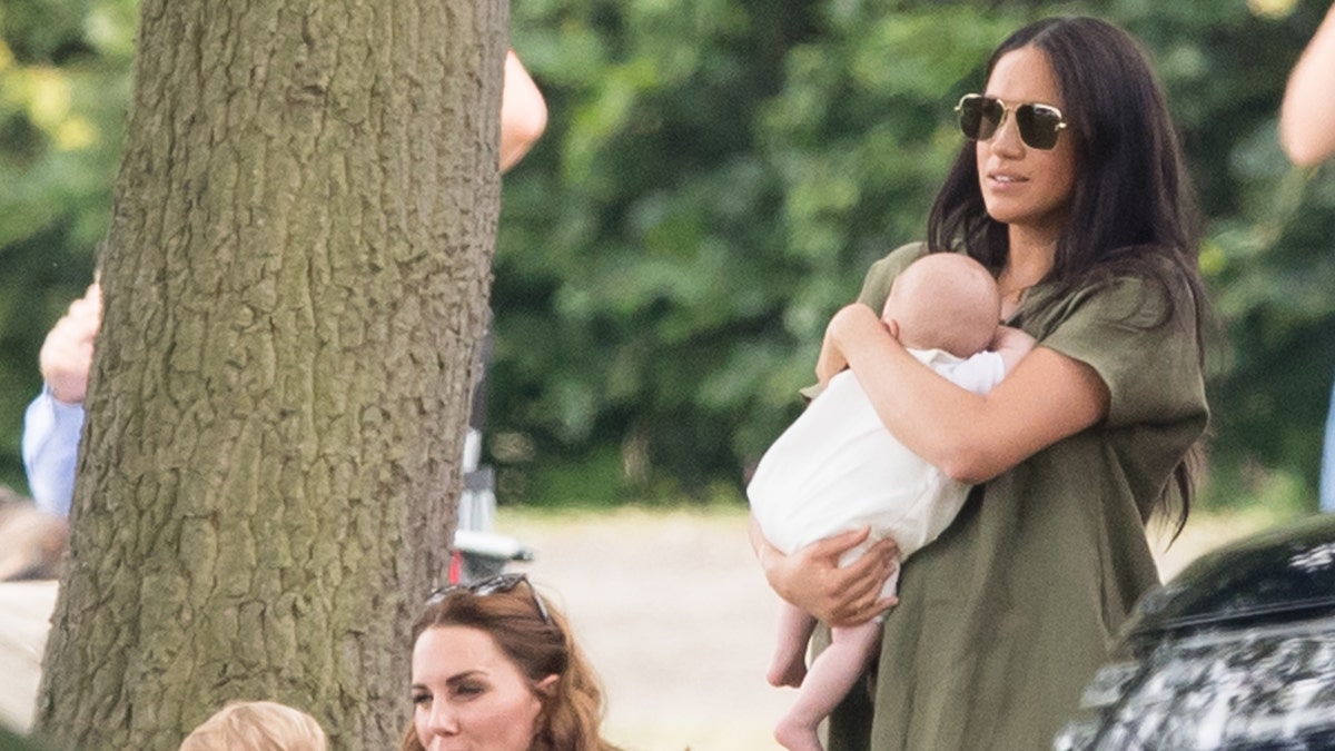 Meghan, Duchess of Sussex and Archie Harrison, with Catherine, Duchess of Cambridge and Prince Louis