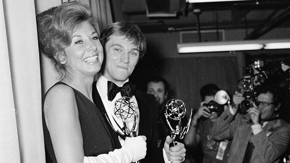 Michael Learned and Richard Thomas each hold their Emmy Awards for Outstanding Continued Performance in a Leading Role, Hollywood, Calif., May 20, 1973. (Photo by Max Miller/Fotos International/Getty Images)