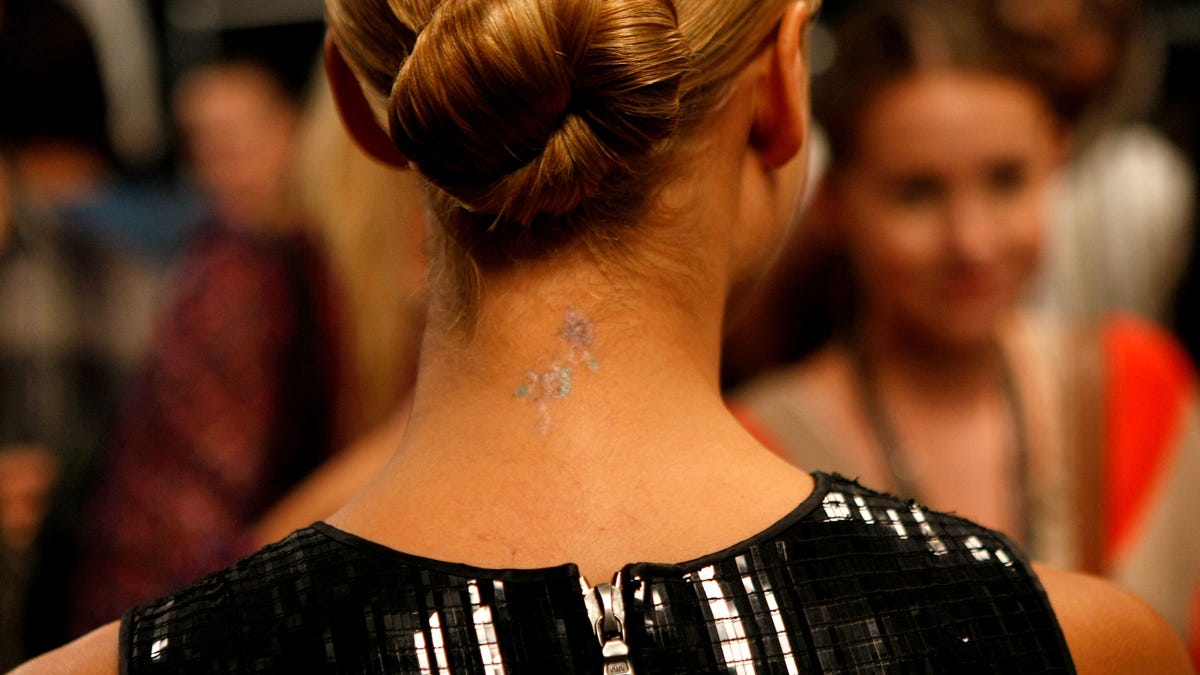 Jessica Alba's neck tattoo in 2010.(Photo by Michael Buckner/Getty Images for Mercedes-Benz)