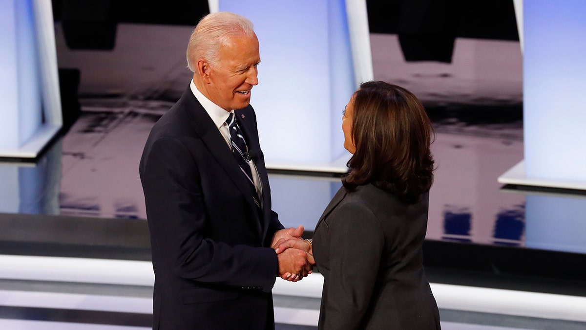 Former Vice President Joe Biden and Sen. Kamala Harris, D-Calif., shake hands before the second of two Democratic presidential primary debates hosted by CNN Wednesday, July 31, 2019, in the Fox Theatre in Detroit.