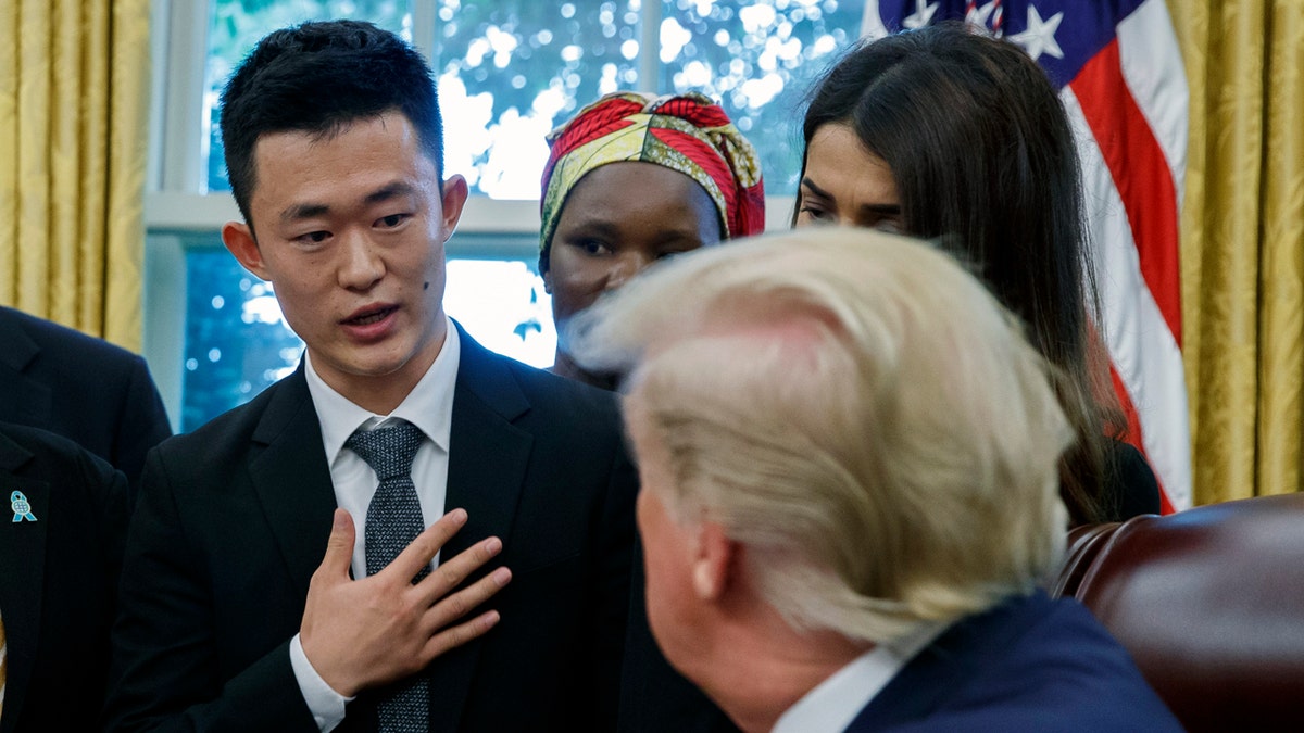 President Trump listens to Ilyong Ju, a Christian from North Korea, as he meets with survivors of religious persecution in the Oval Office of the White House on Wednesday, July 17, 2019, in Washington. (AP Photo/Alex Brandon)