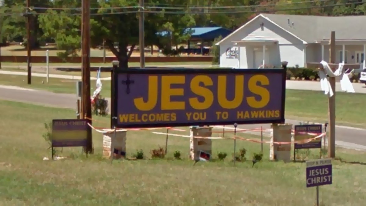 The city of Hawkins and a church congregation are fighting over a "Jesus Welcomes You to Hawkins" sign alongside U.S. 80 that was removed overnight.