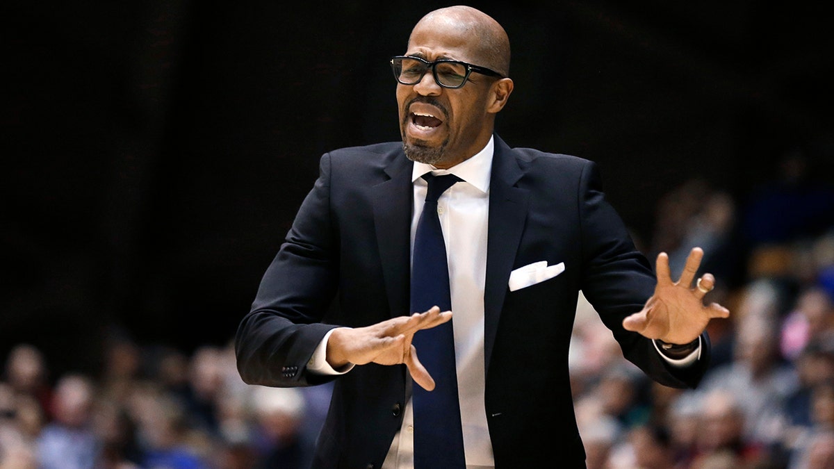 FILE - In this Jan. 10, 2015, file photo, Penn head coach Jerome Allen shouts instructions to his players during the second half of an NCAA college basketball game against Princeton in Princeton, N.J. (AP Photo/Mel Evans, File)