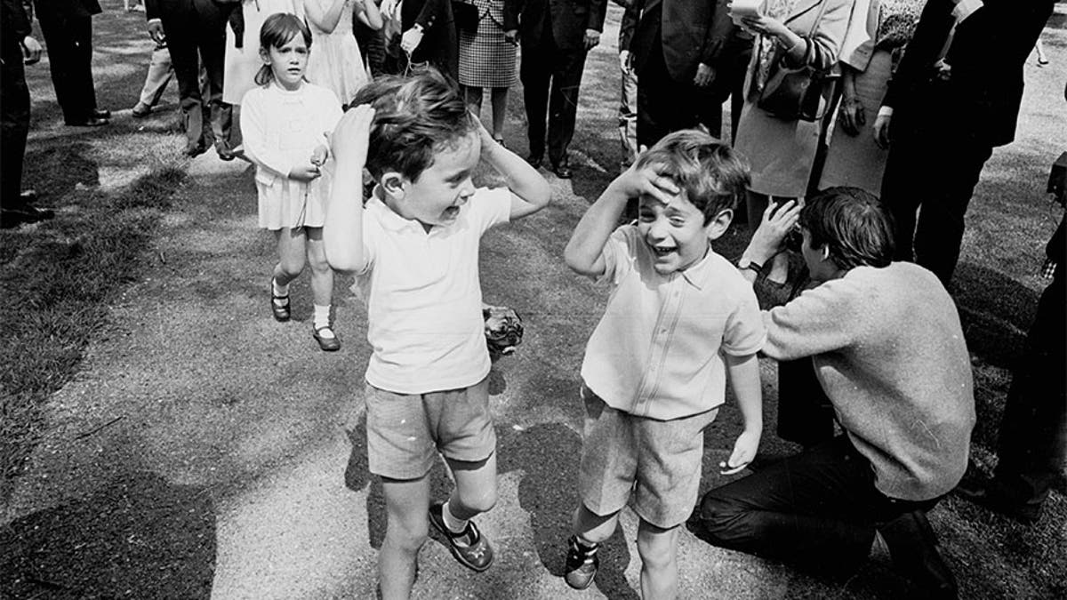 John F. Kennedy Jr. (right) with his cousins Anthony and Tina (behind), the children of Jackie's sister Lee Radziwill, in Green Park, London, on May 13, 1965. (Photo by McCabe/Express/Getty Images)