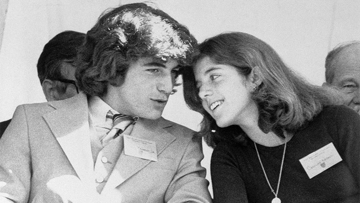 John F. Kennedy Jr. and his sister, Caroline, chat while attending a ceremony at which their late father was honored.