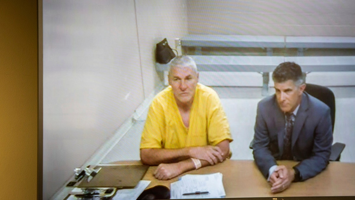 Former Washington State quarterback and Superbowl MVP Mark Rypien appears alongside defense attorney Chris Bugbee via video conference for a hearing presided over by commissioner Kristin O'Sullivan on Monday, July 1, 2019, in Spokane, Wash. (Libby Kamrowski/The Spokesman-Review via AP)
