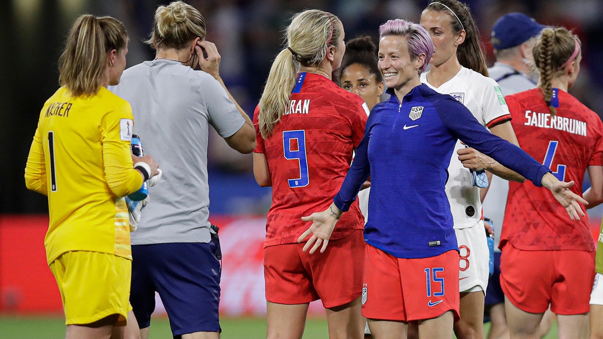 United States' Megan Rapinoe prepares to hug United States goalkeeper Alyssa Naeher after the Women's World Cup semifinal soccer match between England and the United States, at the Stade de Lyon, outside Lyon, France, Tuesday, July 2, 2019. (AP Photo/Alessandra Tarantino)