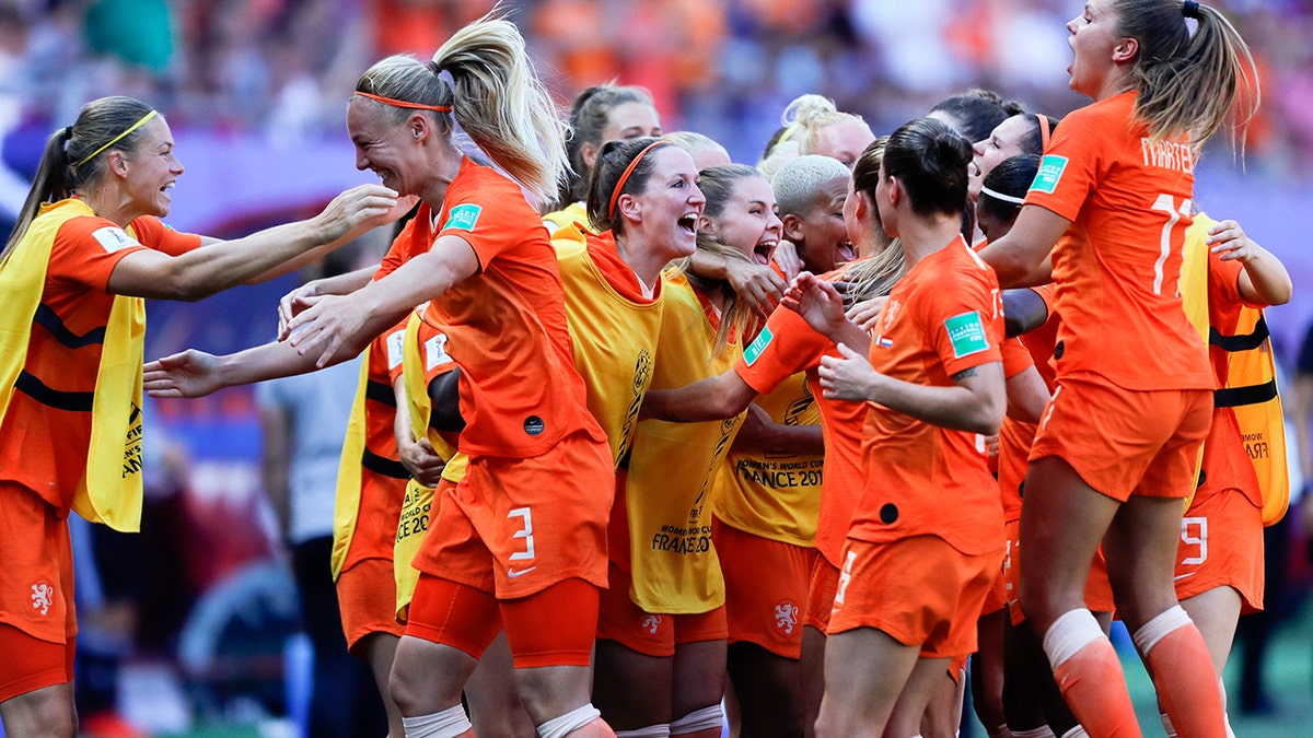 Netherlands' players celebrate their victory after the Women's World Cup quarterfinal soccer match between Italy and the Netherlands, at the Stade du Hainaut stadium in Valenciennes, France, Saturday, June 29, 2019. (AP Photo/Michel Spingler)