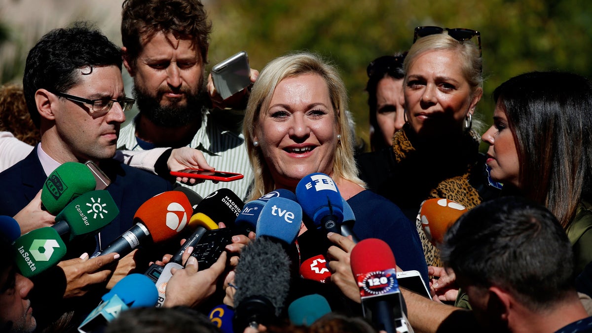 Ines Madrigal speaks to journalists outside a court in Madrid, Spain. A woman who became a crusader for babies abducted during Spain's 20th-century dictatorship said Thursday that she has found her biological family and learned that her mother gave her up voluntarily. (AP Photo/Manu Fernandez, File)