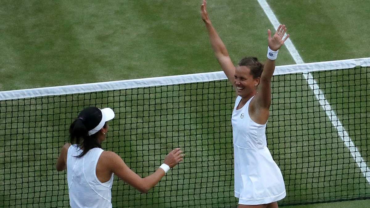 Czech Republic's Barbora Strycova, right, and Taiwan's Su-Wei Hsieh celebrate defeating Canada's Gabriela Dabrowski and China's Yifan Xu in the women's doubles final match of the Wimbledon Tennis Championships in London, Sunday, July 14, 2019. (AP Photo/Ben Curtis)