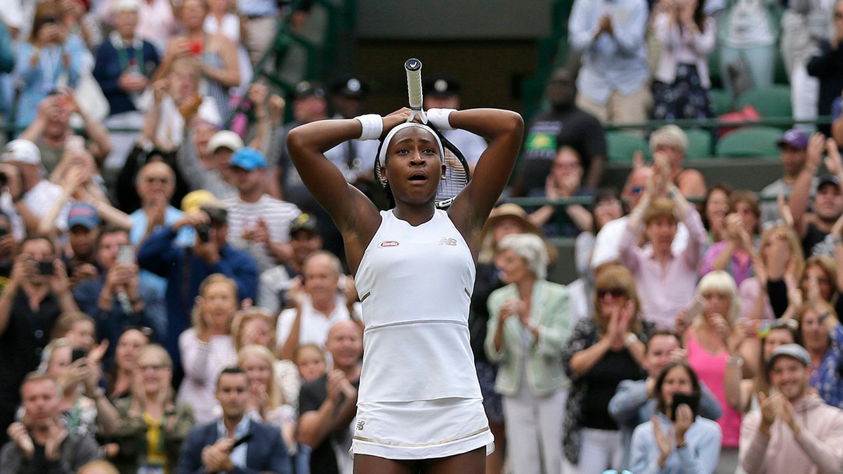 United States' Cori "Coco" Gauff reacts after beating United States's Venus Williams in a Women's singles match during day one of the Wimbledon Tennis Championships in London, Monday, July 1, 2019. (AP Photo/Tim Ireland)