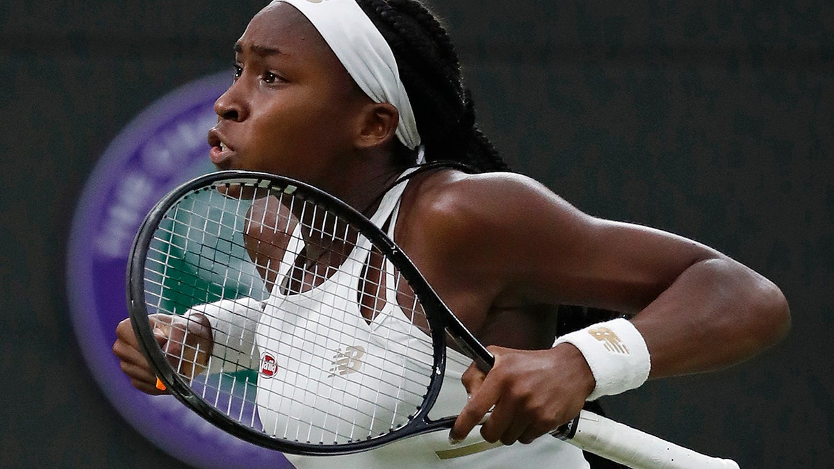 United States' Cori "Coco" Gauff celebrates after beating Slovakia's Magdalena Rybaikova in a Women's singles match during day three of the Wimbledon Tennis Championships in London, Wednesday, July 3, 2019. (AP Photo/Alastair Grant)