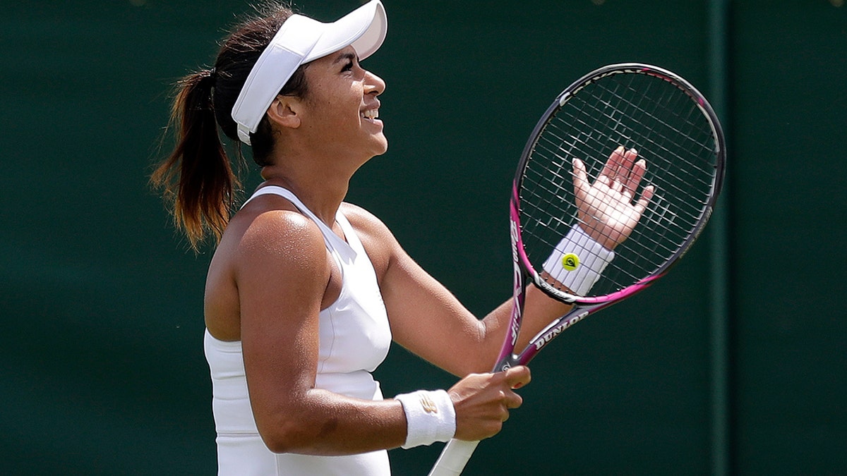 Britain's Heather Watson celebrates after beating United States' Caty McNally to win their Women's singles match during day one of the Wimbledon Tennis Championships in London, Monday, July 1, 2019. (AP Photo/Ben Curtis)