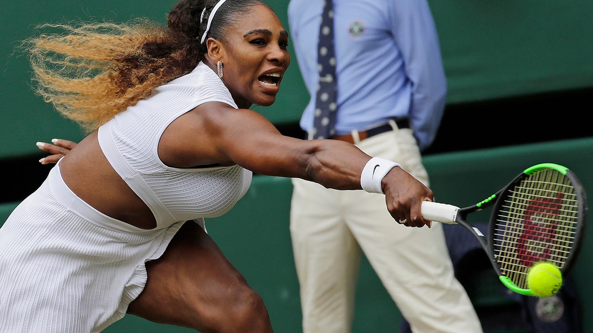 United States' Serena Williams returns to Germany's Julia Goerges in a Women's singles match during day six of the Wimbledon Tennis Championships in London, Saturday, July 6, 2019. (AP Photo/Ben Curtis)