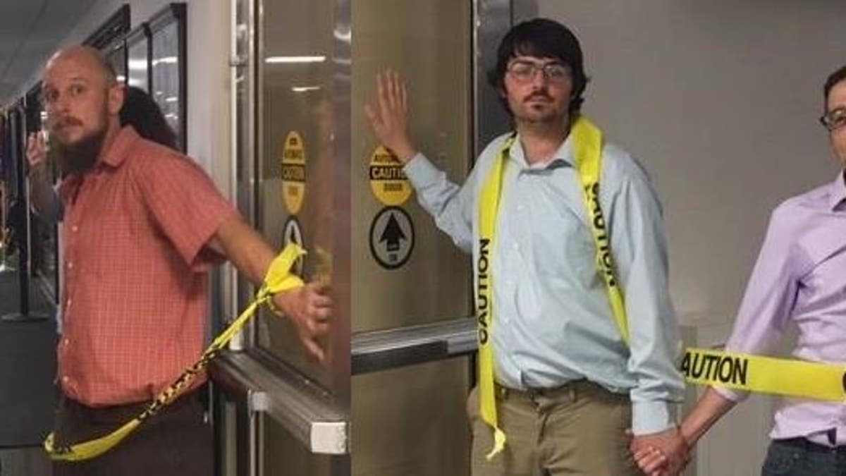 Environmental protesters superglued themselves together and to two doorways connecting the Cannon building to the U.S. Capitol