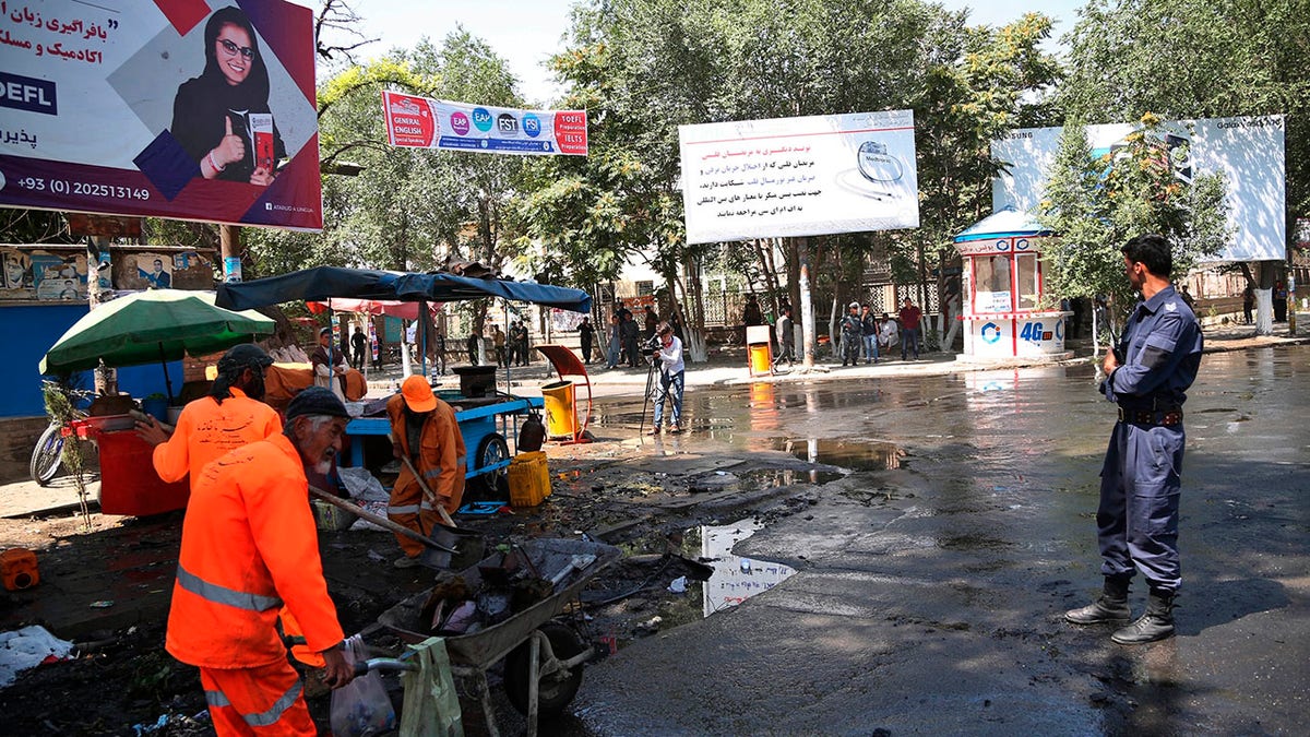 Afghan security forces stand guard near the site of an explosion in Kabul, Afghanistan, Friday, July 19, 2019. A powerful bomb exploded outside the gates of Kabul University in the Afghan capital on Friday, according to police and health officials. (AP Photo)