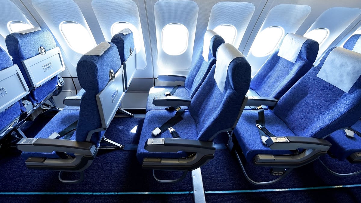 Blue airplane empty seats
