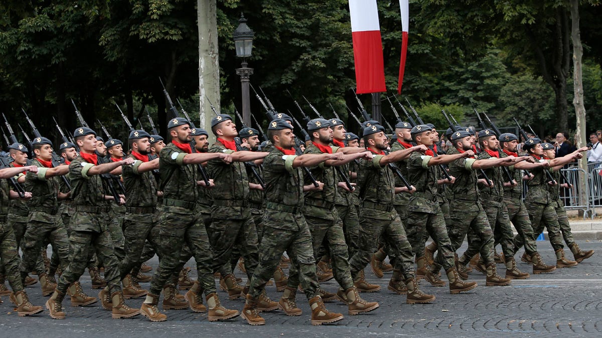 Portuguese troops take part to Bastille Day parade Sunday, July 14, 2019, on the Champs-Elysees avenue in Paris.