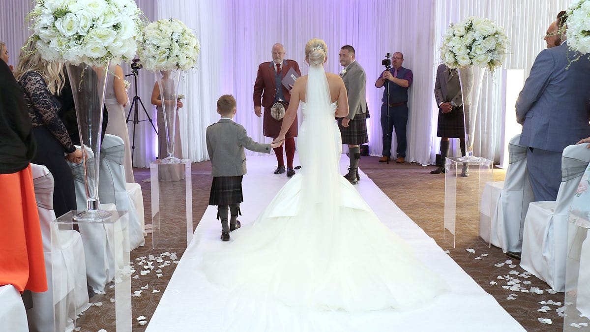 bride with ill son walk down the aisle