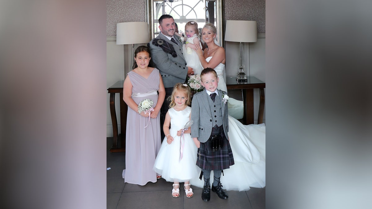Bride with ill son and their family